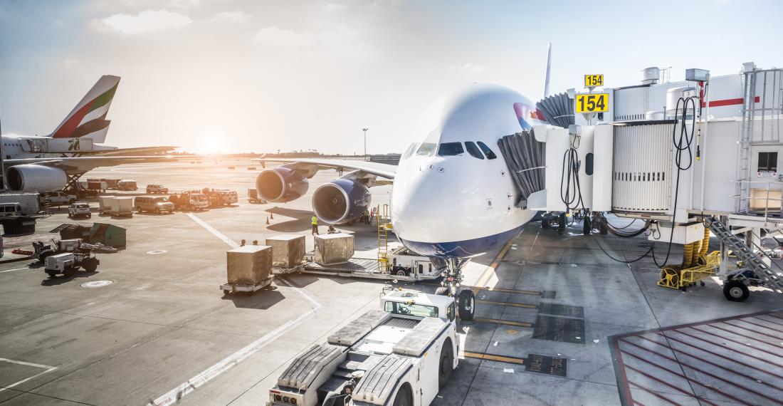 Airplanes docked at an airport.